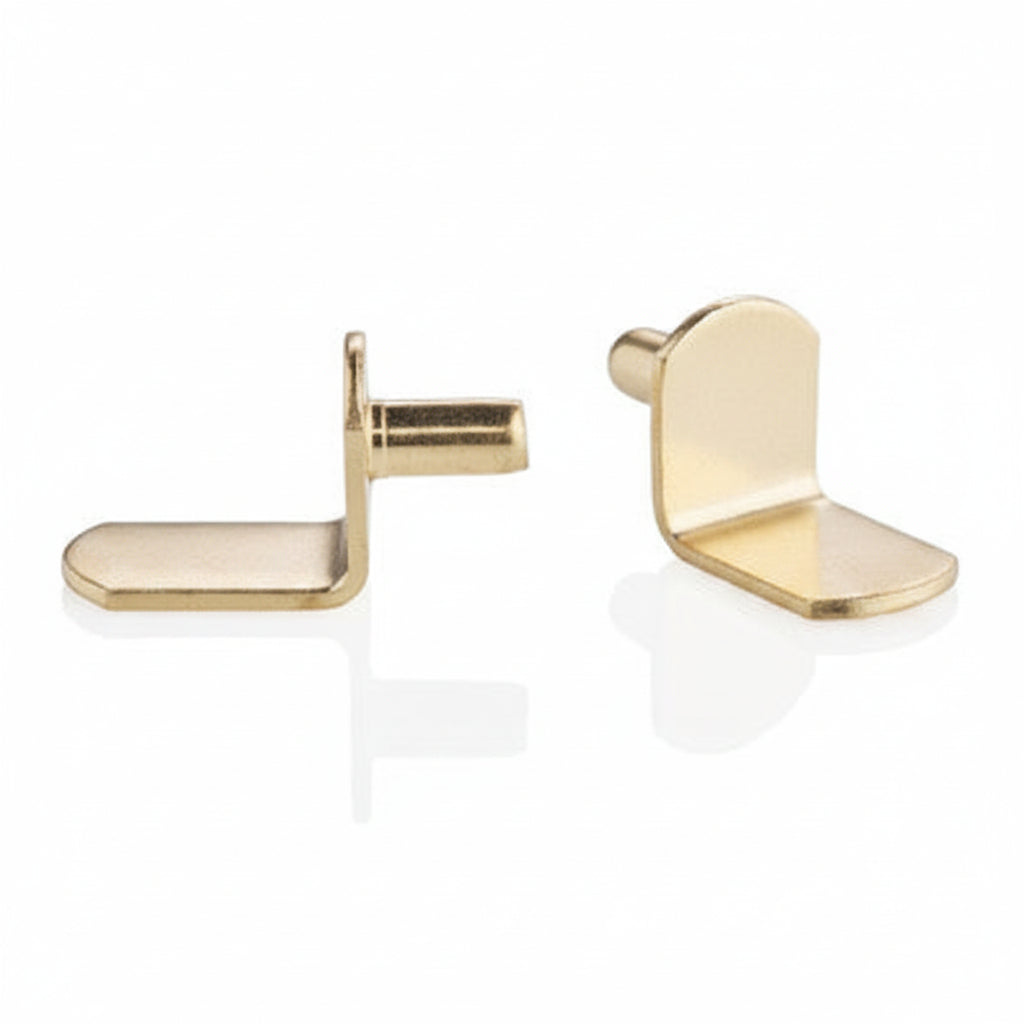 Two polished brass L-shaped shelf support pins.