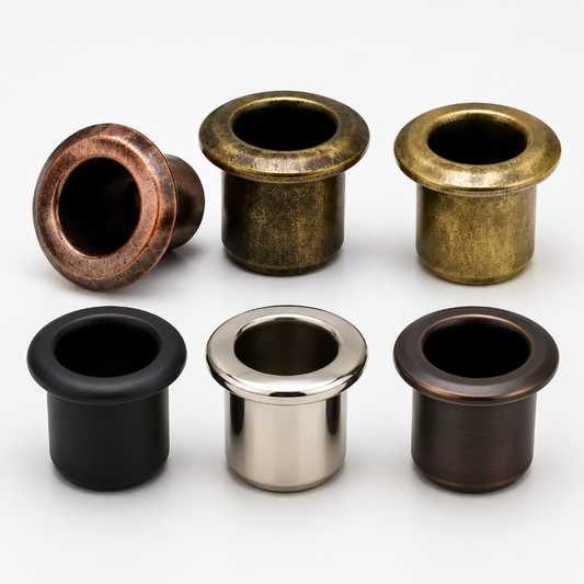 Six metal mounting hardware pieces in different finishes arranged on a light gray background: two copper-toned, two antique gold, one black, and one polished silver.