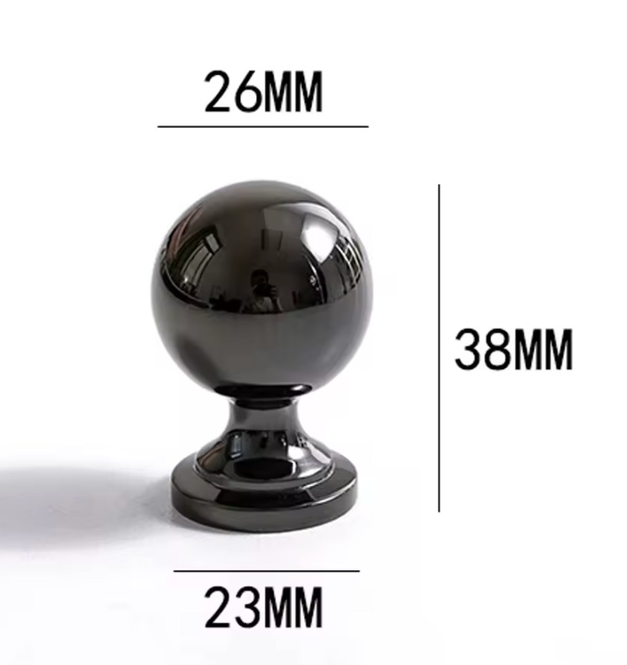 A glossy black spherical cabinet knob on a white background with dimension lines and text indicating a height of 38mm, top diameter of 26mm, and base diameter of 23mm.
