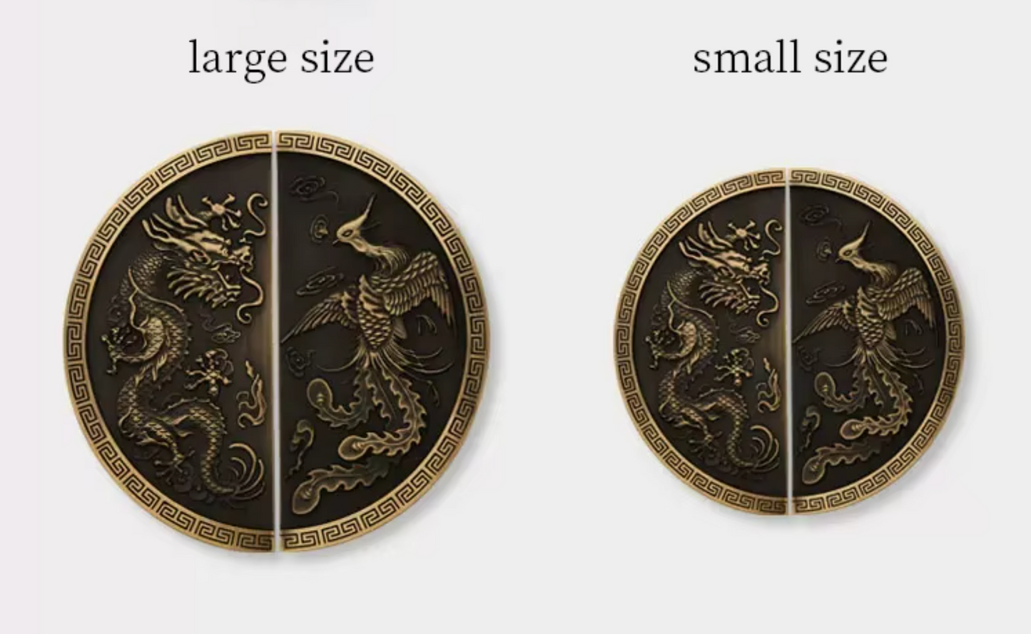 Two round decorative wall art pieces shown side by side on a light gray background, labeled 'large size' and 'small size'. Each piece is split vertically into two halves, featuring embossed dragon and phoenix motifs in metallic gold on a dark bronze-black background, with a Greek key border around the edge.