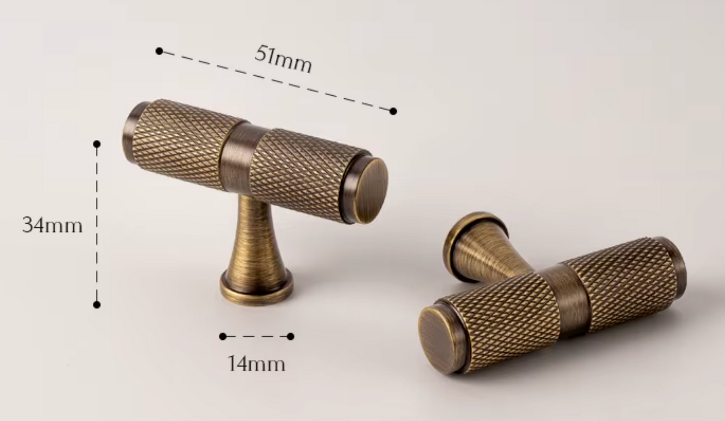 Two antique brass cabinet knobs with dimension callouts showing 51mm length, 34mm height, and 14mm width on a light neutral background.
