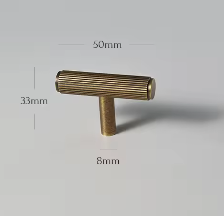 A brass T-shaped cabinet knob with a ribbed cylindrical handle and a straight post base, shown on a light gray background with dimension labels indicating 50mm width, 33mm height, and 8mm base depth.