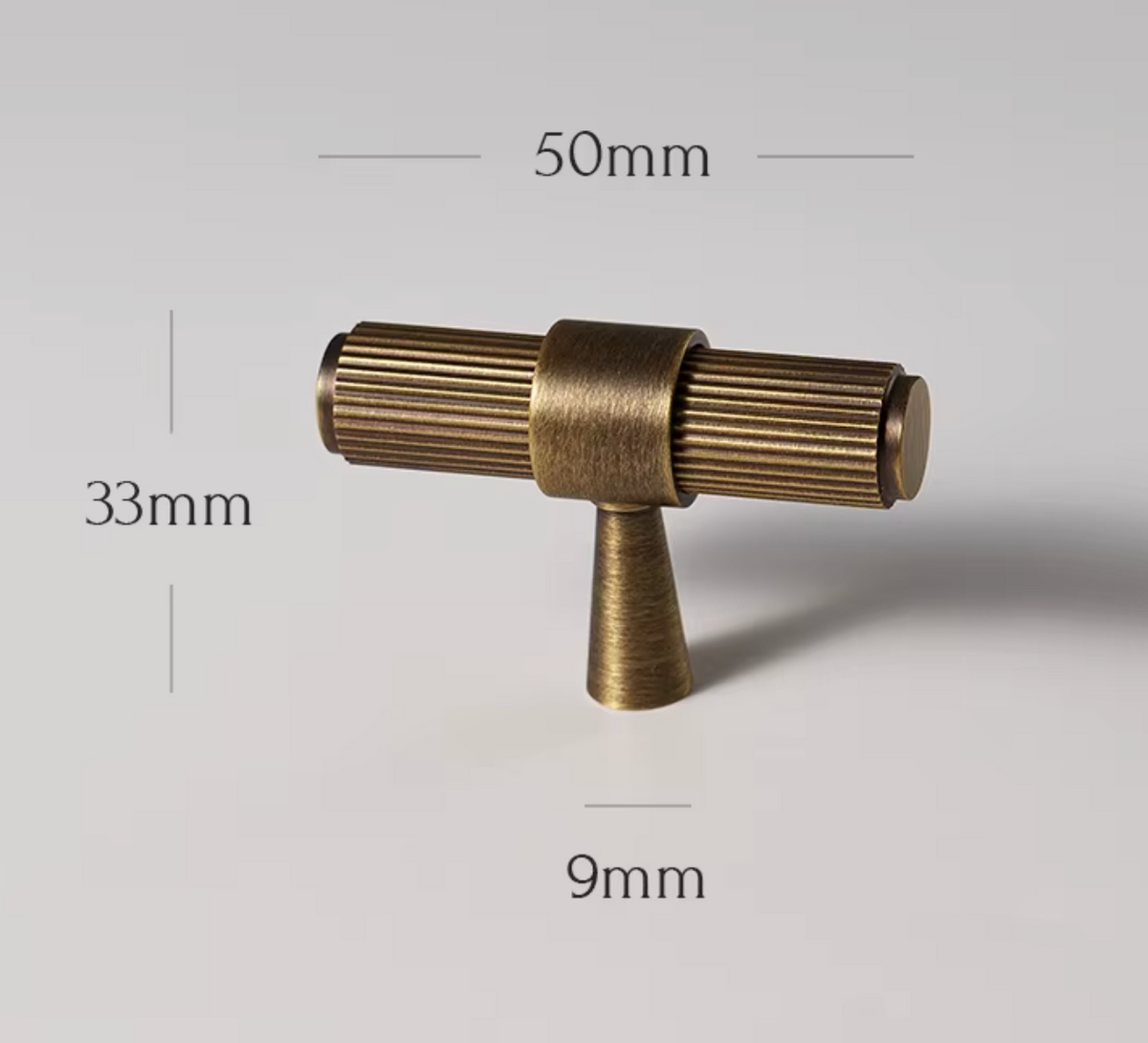 An antique brass drawer pull handle with dimension labels showing 50mm width, 33mm height, and 9mm base on a light gray background.