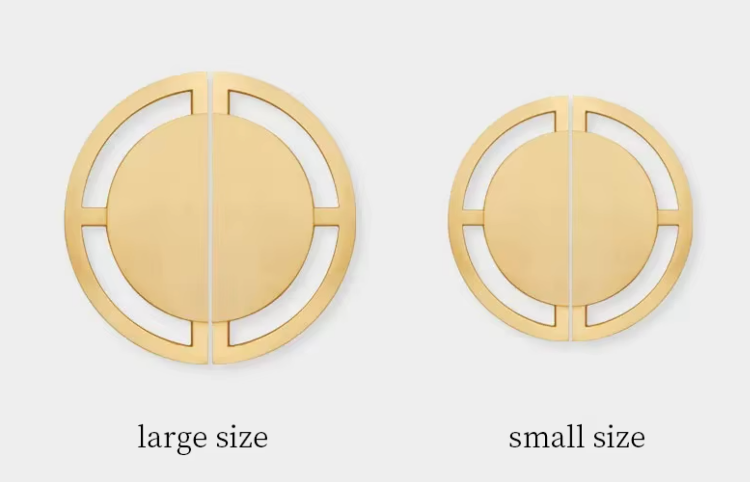 Two circular wall hooks shown side by side on a light gray background, labeled 'large size' and 'small size'. Both are metallic gold with a minimalist cutout design.