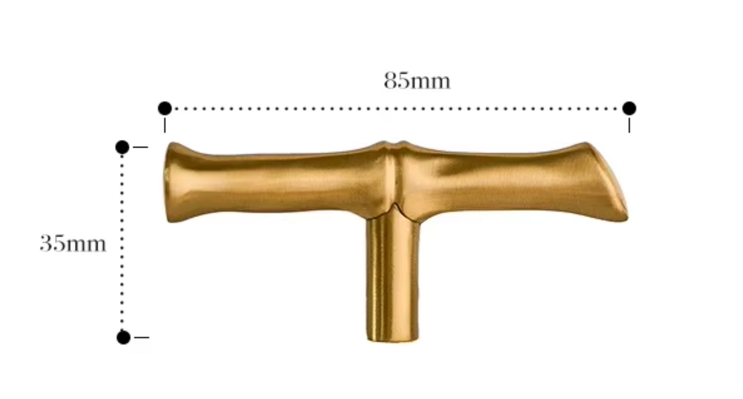 A brass T-shaped cabinet knob shown with dimension lines indicating a width of 85mm and a height of 35mm on a plain white background.