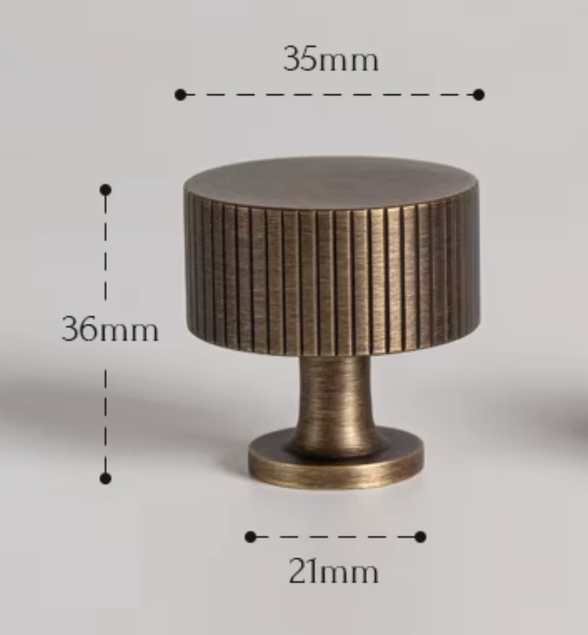 A cylindrical cabinet knob with a brushed metal finish, shown with dimension labels indicating a height of 36mm, top diameter of 35mm, and base diameter of 21mm on a light gray background.