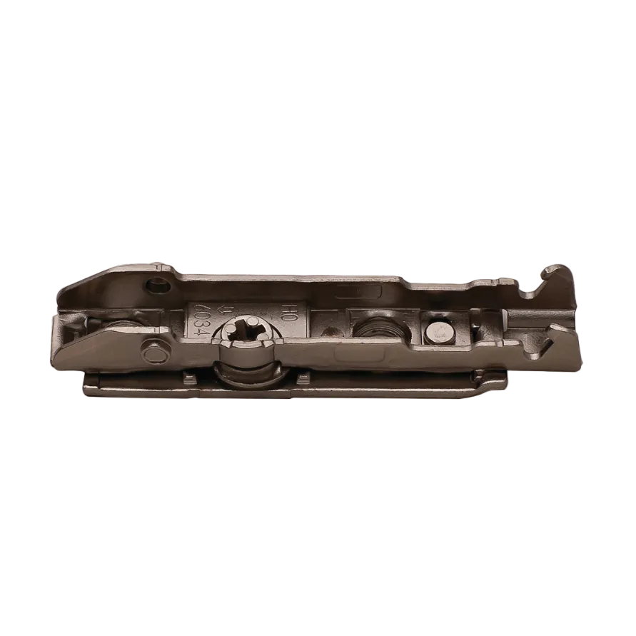 A dark metallic hardware component, likely a cabinet or door lock mechanism, shown from a top-down perspective on a solid white background.