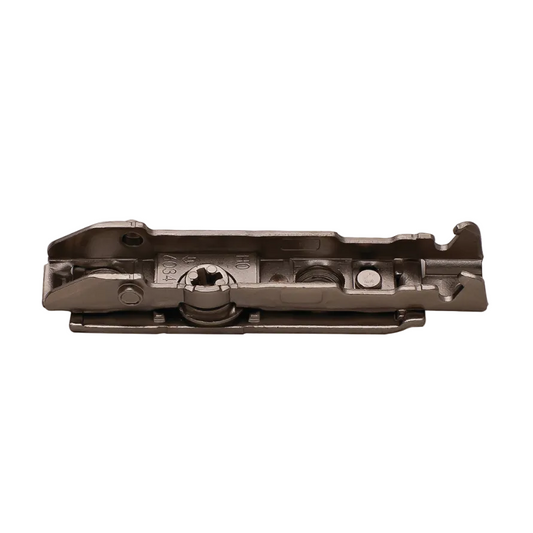 A dark metallic hardware component, likely a cabinet or door lock mechanism, shown from a top-down perspective on a solid white background.